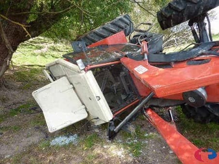 A SAME tractor on its side