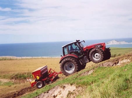 SAME Rubin tractor towing a seed drill uphill